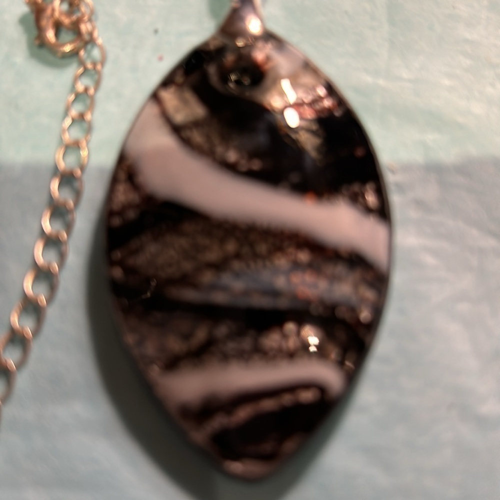 Long silver chain with glass pendant with silver clasp black white colours